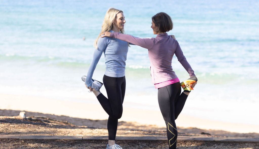 Amelia and Dr Jasmina performing a quad stretch