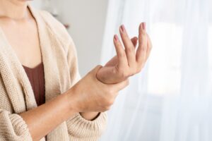 Photo of woman with joint pain her her wrist
